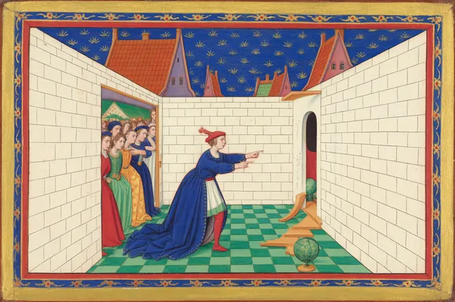 A man at the end of a walled alley points back at a crowd, not seeing the small open door in the wall beside him